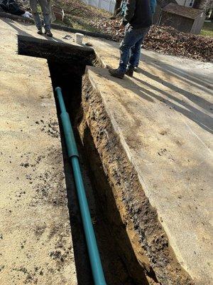 Laying the pipe to connect to the village sewer