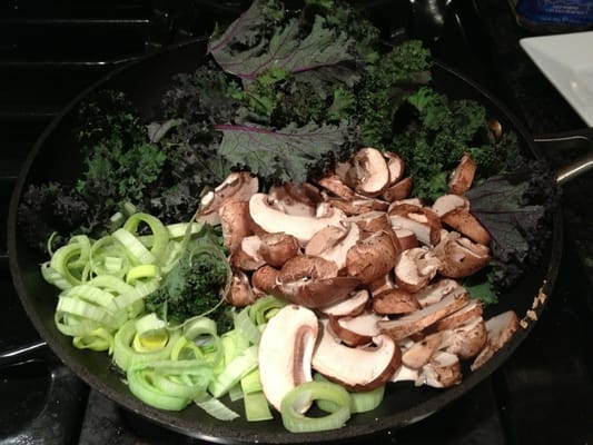 All from the market: kale, cremini mushrooms, and leeks