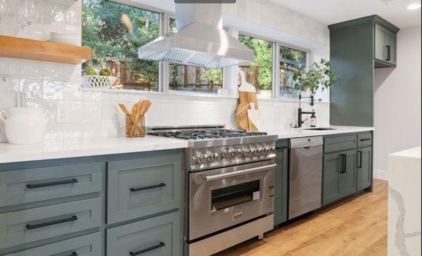 Green Shaker Cabinets. Stainless Steel Appliances. Quarts Calacata Countertops.