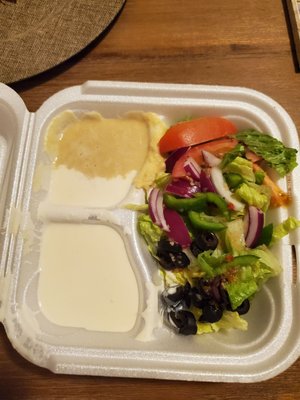 Garden salad, hummus and garlic sauce that they didn't bother to place in a separate container so it mixed with everything else.