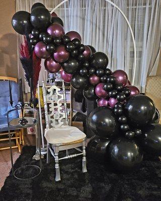 Mini throne chair for hire displayed with this elegant balloon garland Backdrop