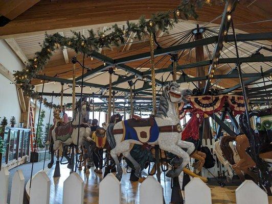 Restored 1906 Dentzel carousel featuring farm animals, on the top floor