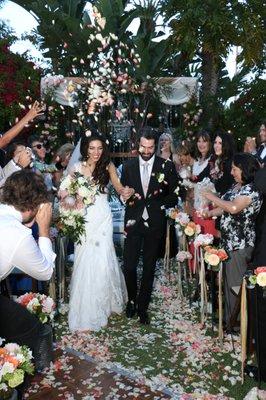 She had prepared pouches of petals for those seated along the aisle so the guests could throw them as we passed