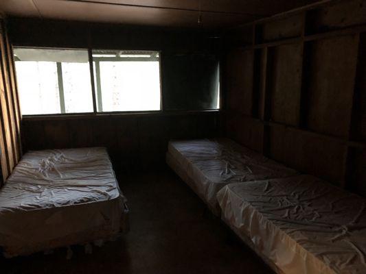 4 twin beds in main sleeping room. (Each cabin is arranged differently and beds can be moved)