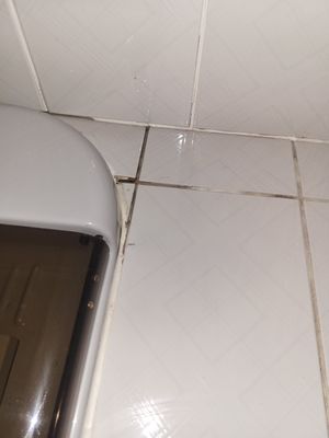 Dirty grout around bath tub