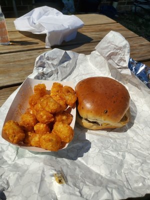 Plain single cheese burger with a side of tots