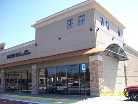 This shopping center in Southaven, MS has a metal awning created and installed by Parasol to help shade the stores