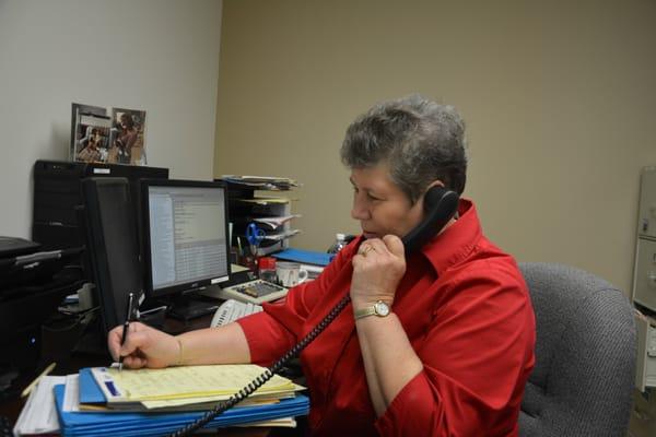 Rose Adler hard at work keeping our clients informed and involved.