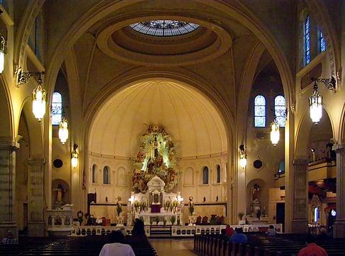 A hand carved retable above the main altar, marble altars and beautiful stained glass!