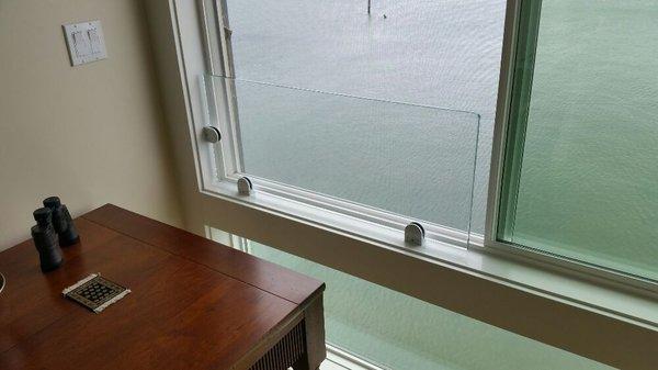 1/2 low iron tempered glass with glass clamps as safety railing at interior home location