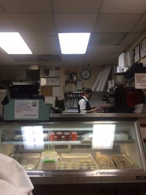 Few desserts located in the fridge under the register