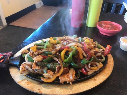 Chicken Fajitas  Flour tortillas  Side of rice, beans,lettuce , tomatoes, and cheese.