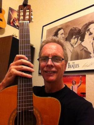 Selfie in my teaching office with my Takamine classical guitar