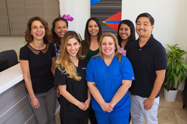 Dr. Lena Bedrossian, DDS (left), our dental staff, and Dr. Leigh Sekimoto, DDS (right).