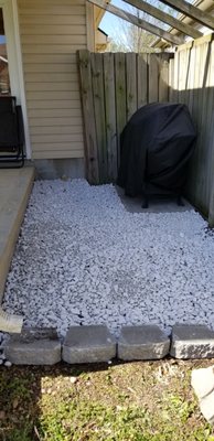 Cleanup, pergola removal, rock, pavers, and border.  This created a nice area for the to grill out just off the patio.