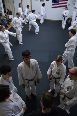 Assistants gathered around the instructor at the December belt testing