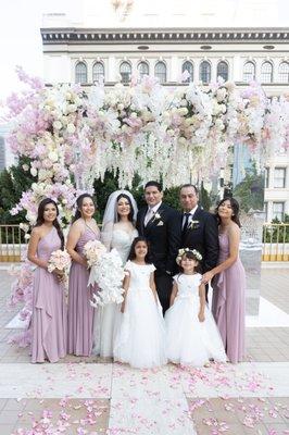 Hanging roses and orchids on mirrored collumns...