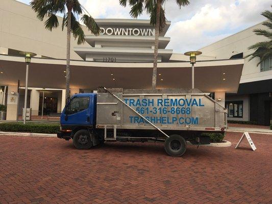 Trash removal of hurricane debri at downtown at the gardens