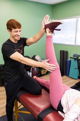 Justin our personal trainer doing a stretch therapy session.