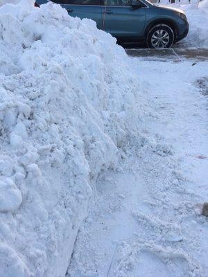 One foot of hard packed snow where a curb should be