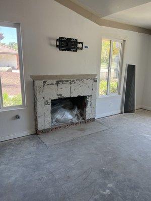 Before and after of our gas log fireplace.