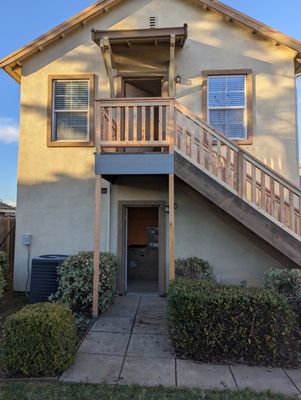 Replaced rotted railing and stair treads. Added additional footings and posts for more support