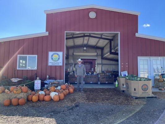 The farm store.  He will help you pick a sweet melon, although all melons are vine ripe.