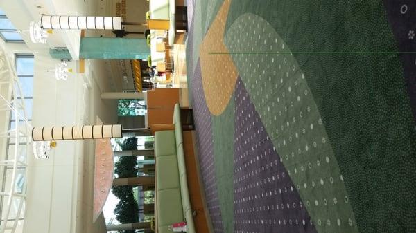 The carpeted play area in the center of Orangerie Cafe, a.k.a. the Millenia Mall food court.