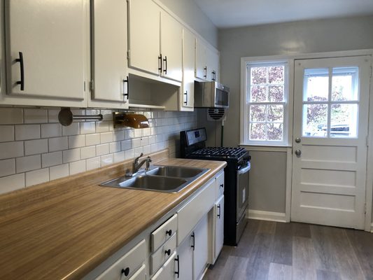 Small kitchen updating. Paint cabinets, flooring, paint walls. Prep for him seller in Towson Maryland.