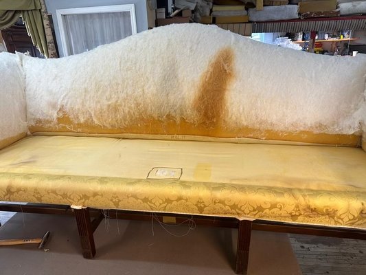 Upholstery removed revealed stain of poured liquid