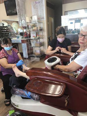 Mom getting treated to a spa mani-pedi.