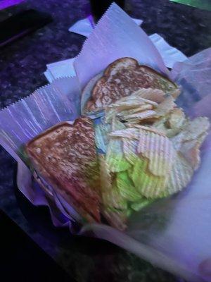 Grilled Turkey and cheese, comes with chips