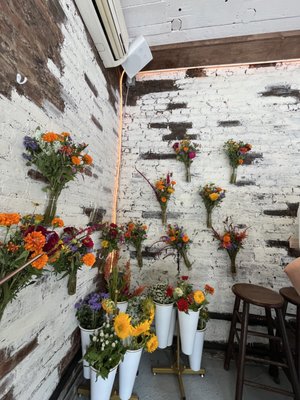 wall of flower bouquets (also for sale!)