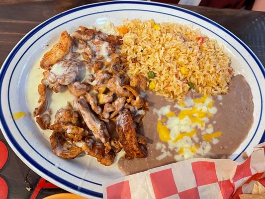 POLLO A LA CREMA Grilled chicken tenders with our special sauce, served with rice and beans