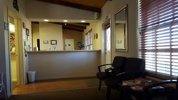 Lobby view of front desk, with child toy area to the left.