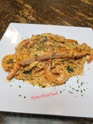 Wild Salmon over Whole Wheat pasta, tossed in Homemade Sauce with Shrimp