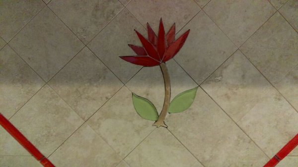 Glass/travertine flower. Pre grout