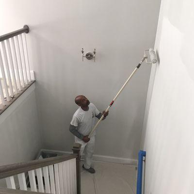 Kenny painting a wall in Heritage in Wake Forest