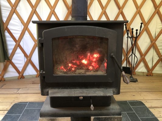 One of two stoves. The other one is a classic kitchen stove with gas burners.  There are usb chargers to charge up phone.