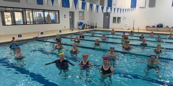 Frisbee fun in the Water Fitness class!