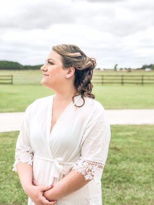 Bride in back yard of property. Horses are behind that fence.