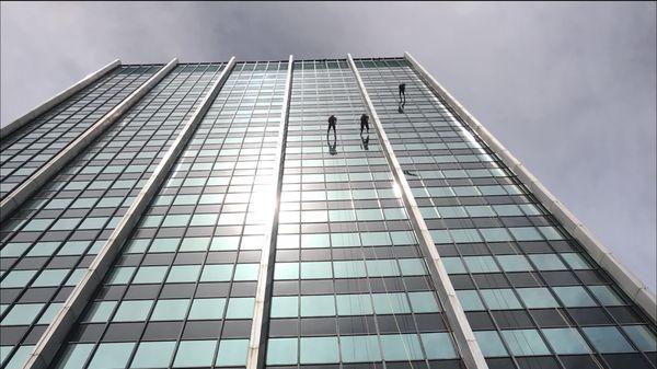 Rappelling down the Chase Bank building to raise funds to help survivors of child sex trafficking.