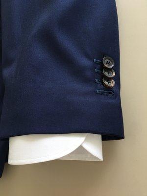 Handmade button holes standard on Handmade Grades, Semi-Bespoke and Bespoke garments. Optional on Made-To-Measure garments.