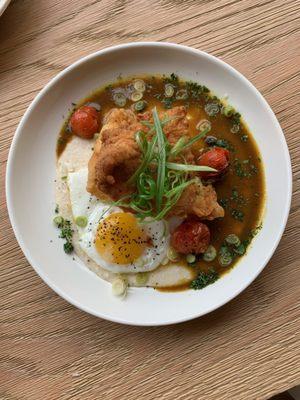 Andouille Sausage Gravy over each bed of grits.