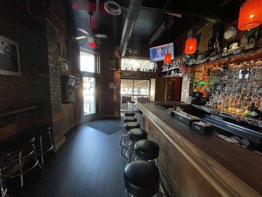 Downstairs bar facing door and patio