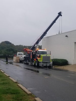 Our 85 Ton Kenworth Rotator, safely delivering another HVAC unit with the help of our licensed crane operator.