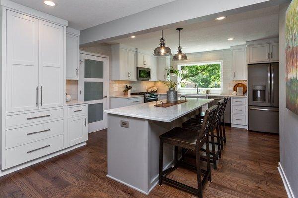 Kitchen remodel: white & gray cabinets, quartz counters.