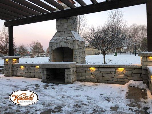 Natural stone fireplace and seat wall