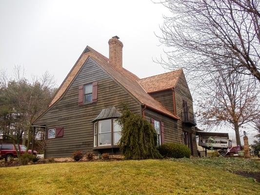 Wooden shingles installed by an MR Roofing crew.