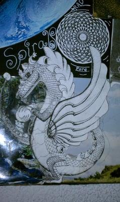 I created this Dragon and Geometric design using a fine mapping quill and inking drafting double quill a fine paint brush and a jar of ink!